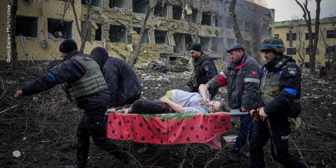 A woman injured in an air strike (Photo: Evgeniy Maloletka/AP)