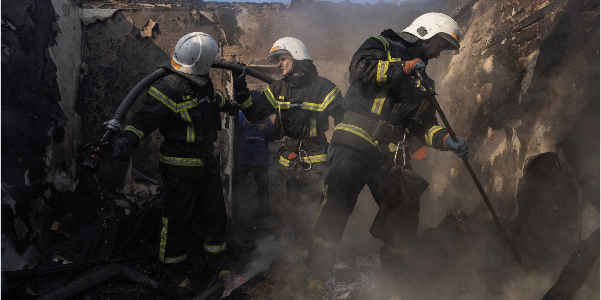 Firefighters work at a residential district that was damaged by shelling, as Russia's invasion of Ukraine continues, in Kyiv, Ukraine March 23, 2022. (Photo: REUTERS/MARKO DJURICA)