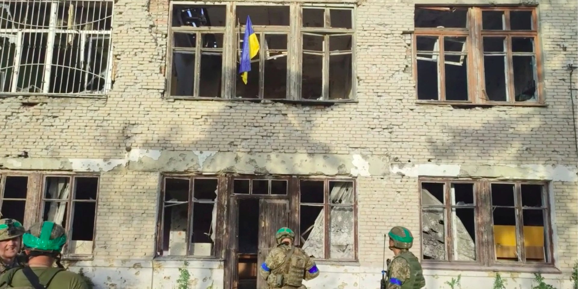 Ukrainian military and the Ukrainian flag in Blagodatny, June 11, 2023 (Photo: 68th Separate Hunting Brigade Oleksy Dovbusha/Handout via REUTERS)