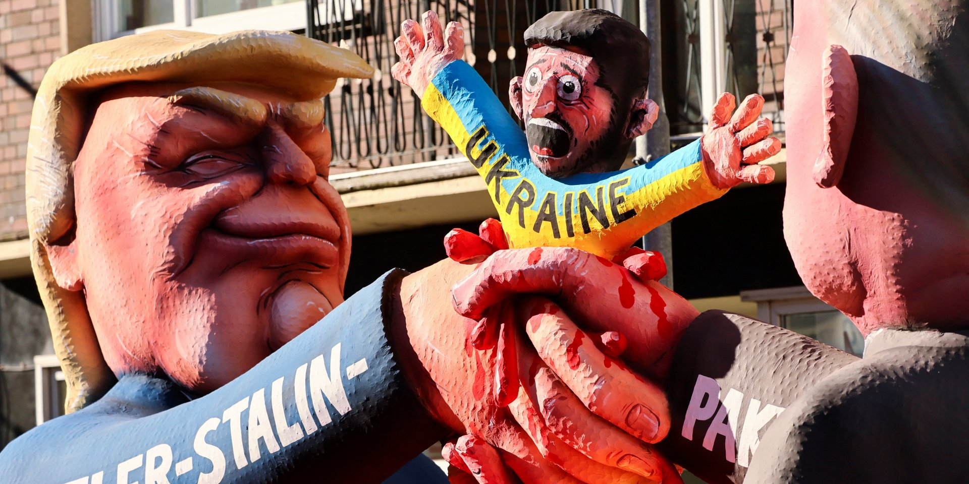 Images of the leaders of the U.S., Russia, and Ukraine on the day of the traditional Rose Monday carnival parade in Düsseldorf, Germany, on March 3. (Photo: REUTERS/Wolfgang Rattay)