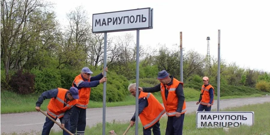 Locals change a Ukrainian road sign 